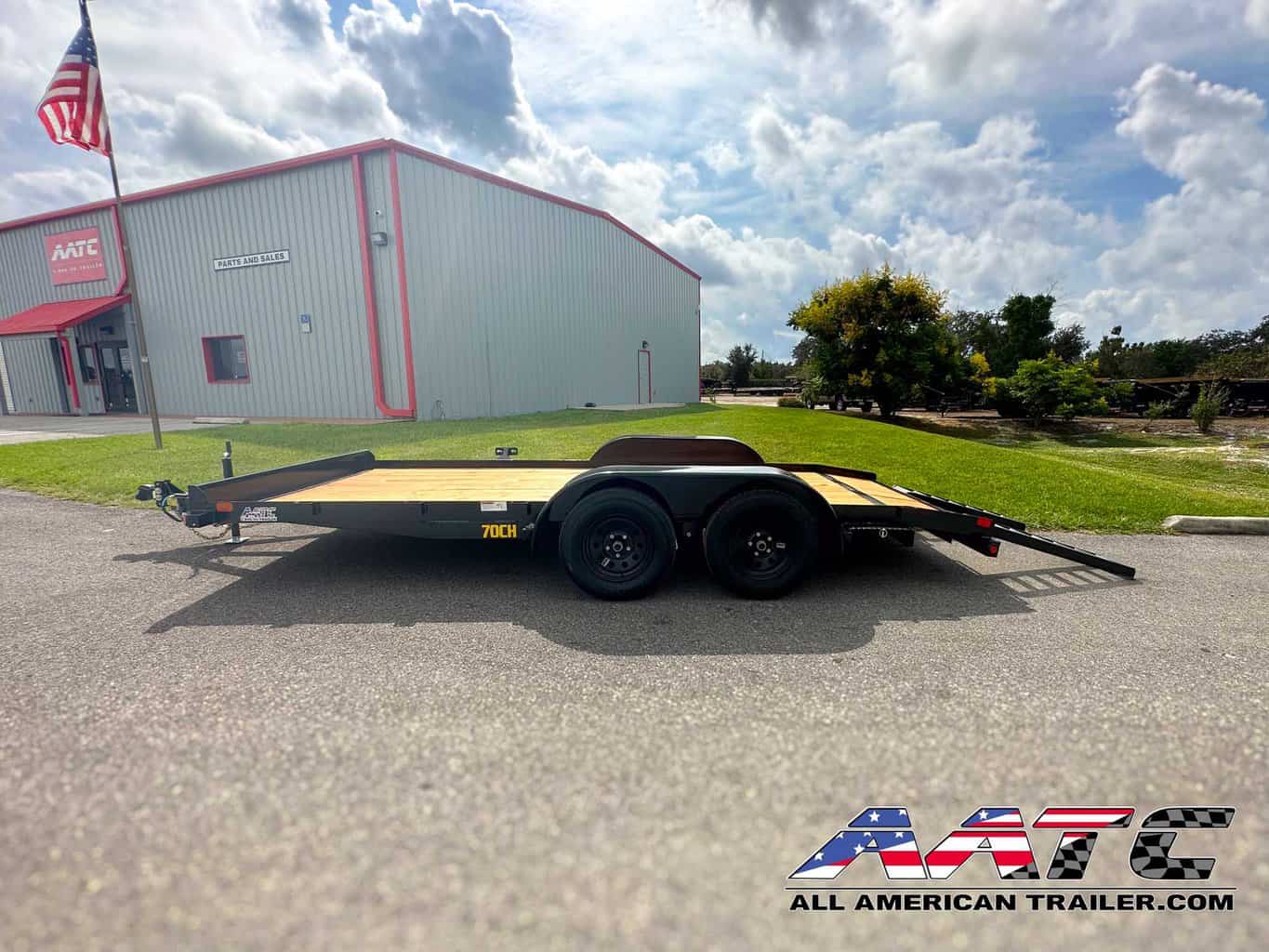 A reliable and versatile 16-foot car hauler trailer from Big Tex, model 70CH. This Big Tex Trailer features a tandem axle, wood deck, and a convenient dovetail design. With a 7000 GVWR, electric brakes, and a load capacity of 5118 lbs, it's a dependable choice for various utility and car hauling needs. The bumper pull tongue type makes it easy to tow and transport your vehicles.