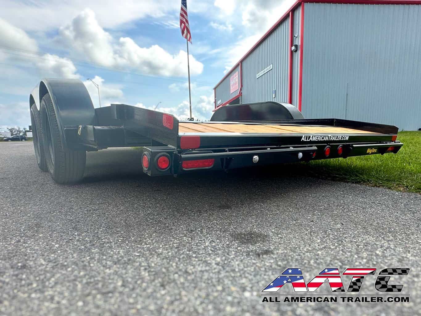 A reliable and versatile 16-foot car hauler trailer from Big Tex, model 70CH. This Big Tex Trailer features a tandem axle, wood deck, and a convenient dovetail design. With a 7000 GVWR, electric brakes, and a load capacity of 5118 lbs, it's a dependable choice for various utility and car hauling needs. The bumper pull tongue type makes it easy to tow and transport your vehicles.